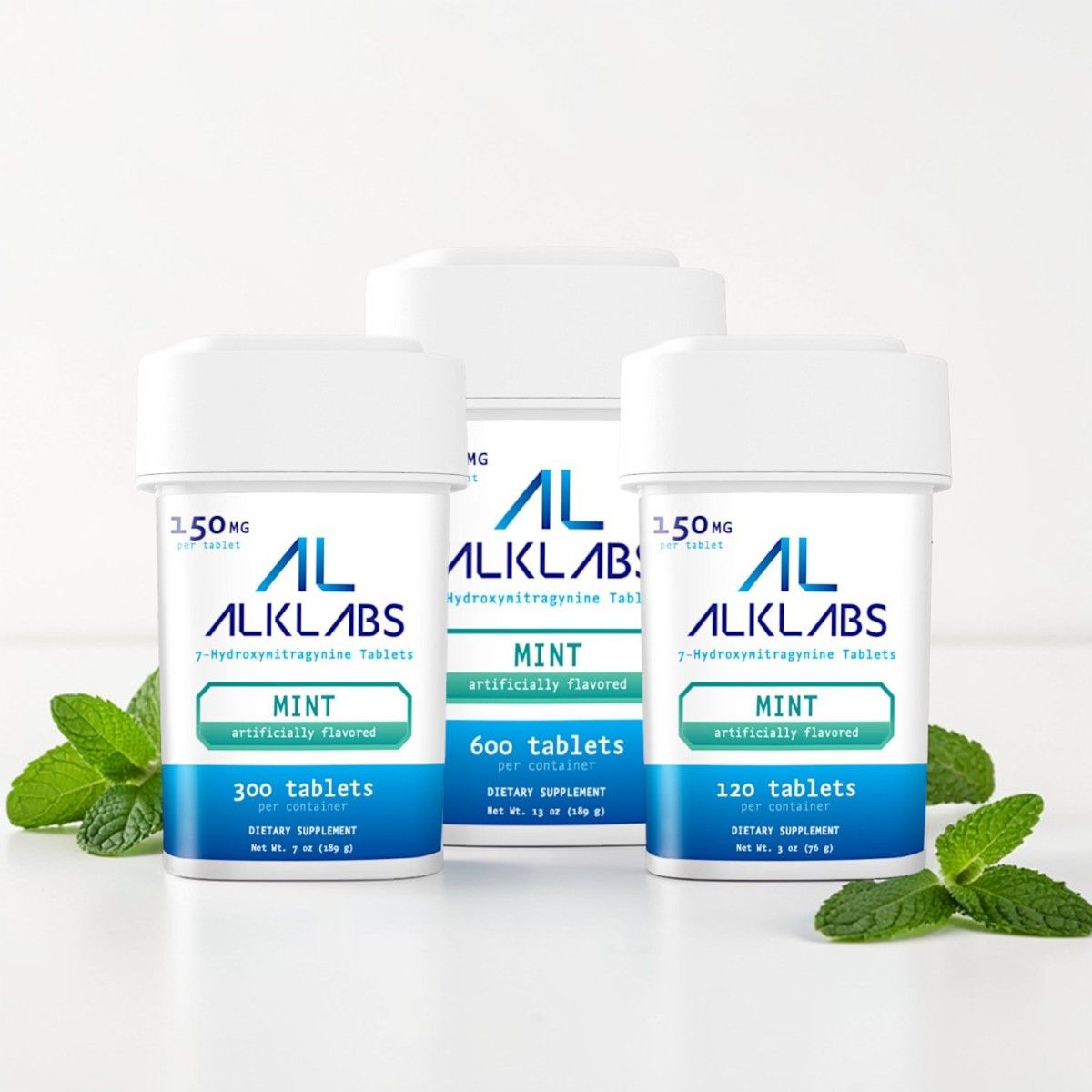 Three bottles of mint tablets on a white background.