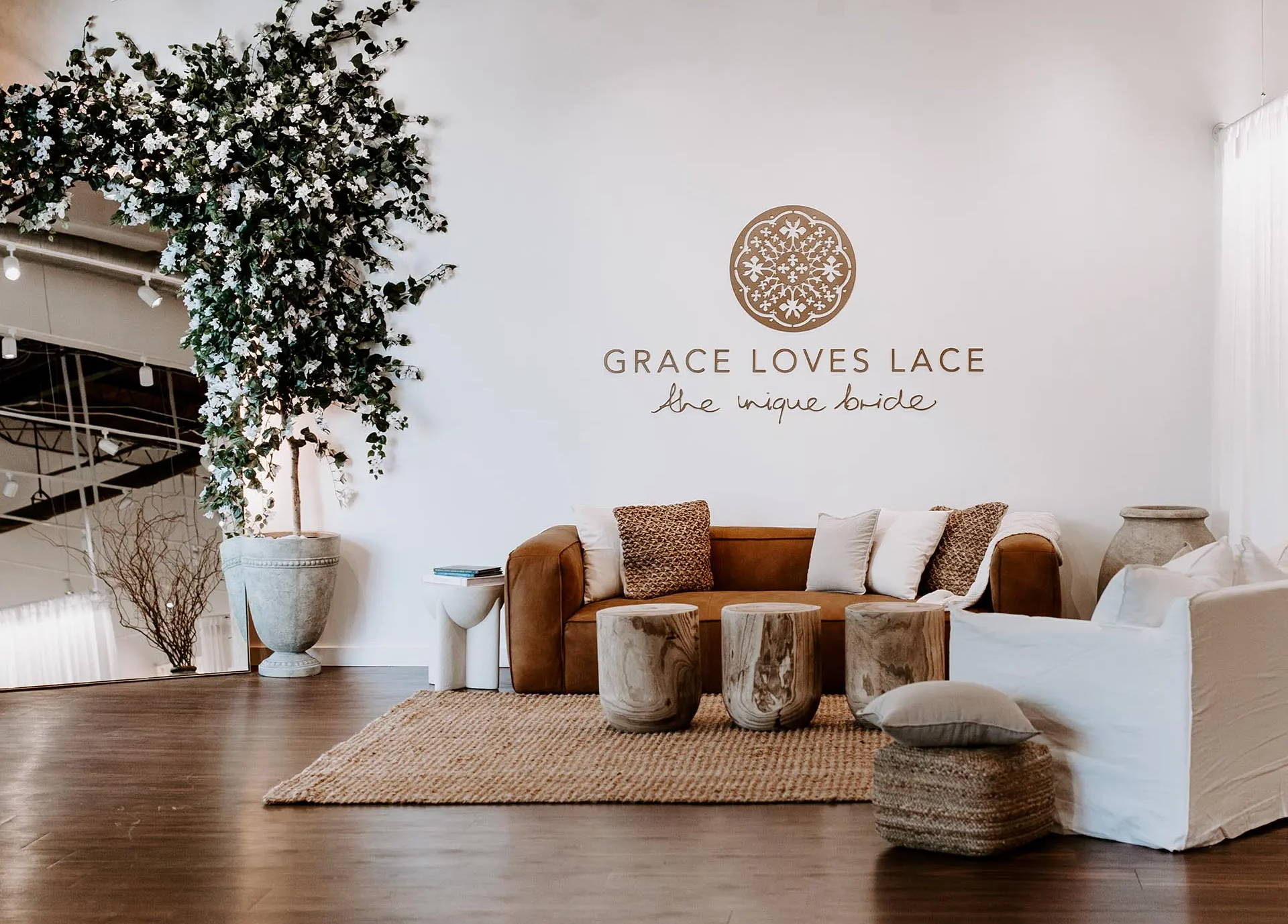 Front of Grace Loves Lace showroom with signature white bouganvillea