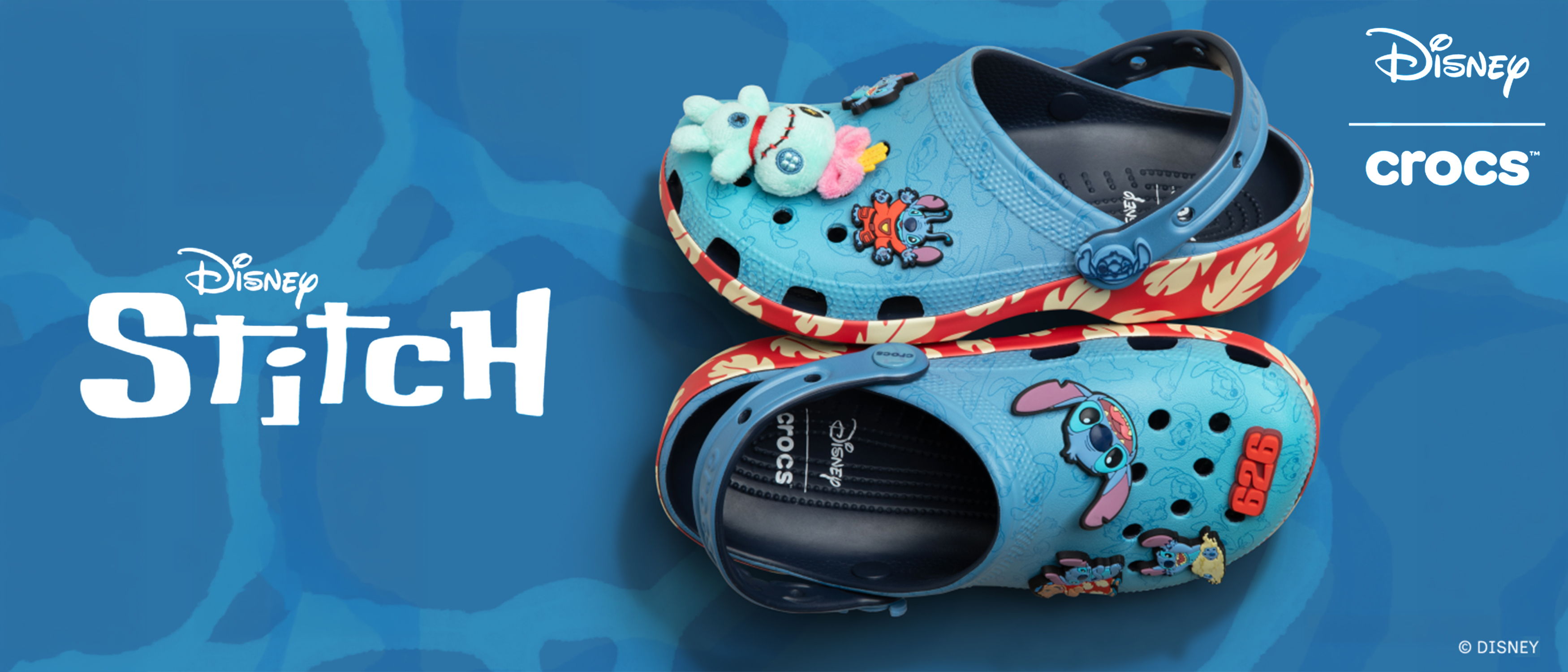Disney Stitch Crocs featuring blue design with colorful decorations.