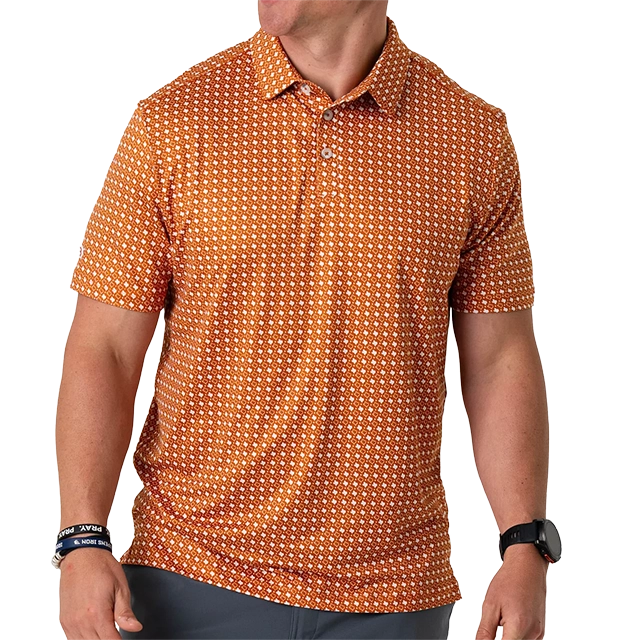 Man wearing an orange patterned polo shirt, looking to the side.