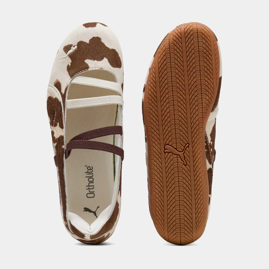 A side view of a brown and white patterned ballet flat shoe.