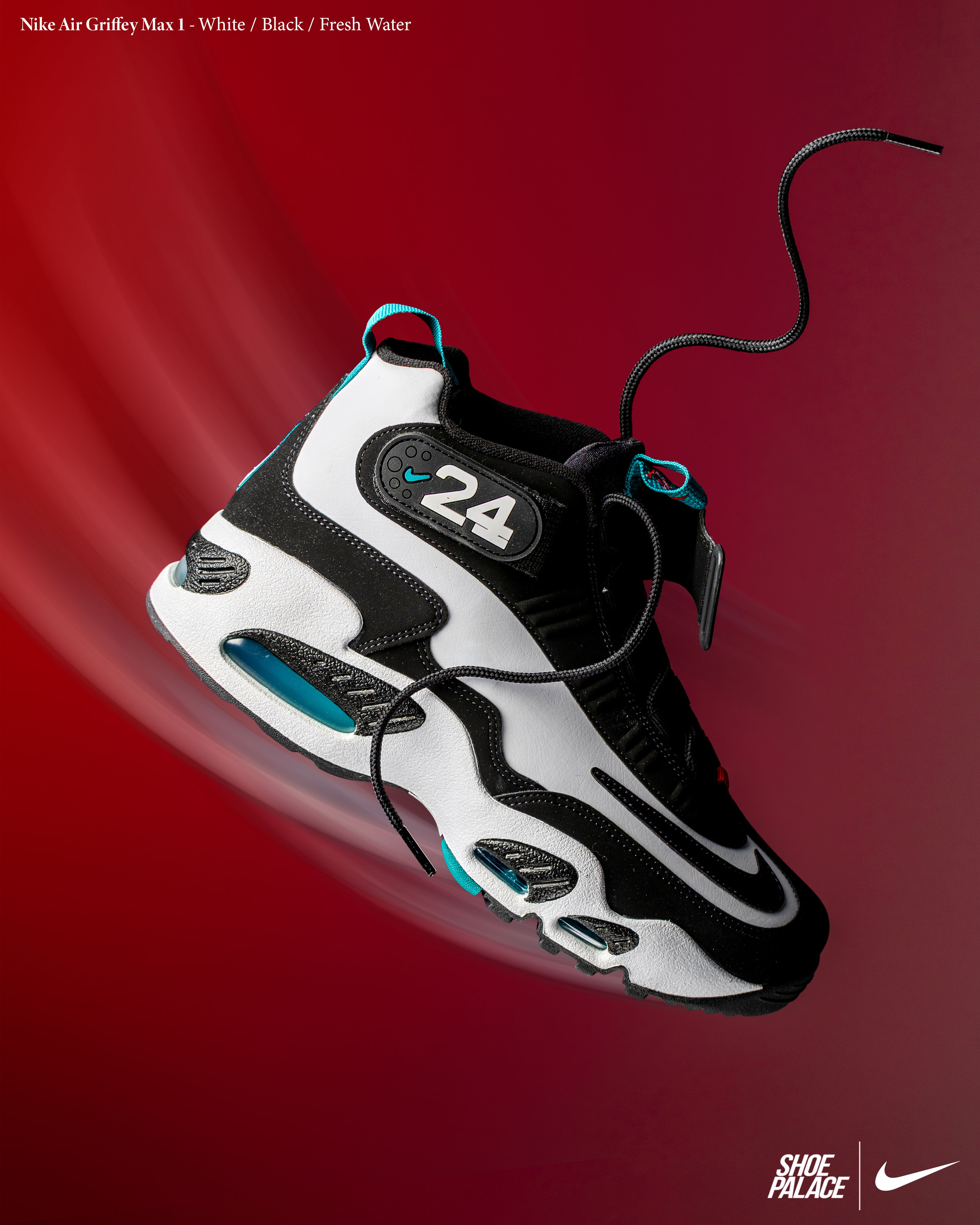 Black and white Nike sneaker with blue accents on a red background.