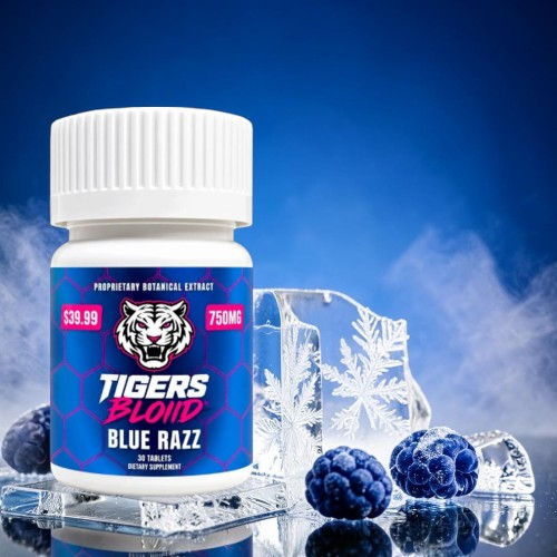 Bottle of Tigers Blond Blue Razz on ice with blueberries and blue background.
