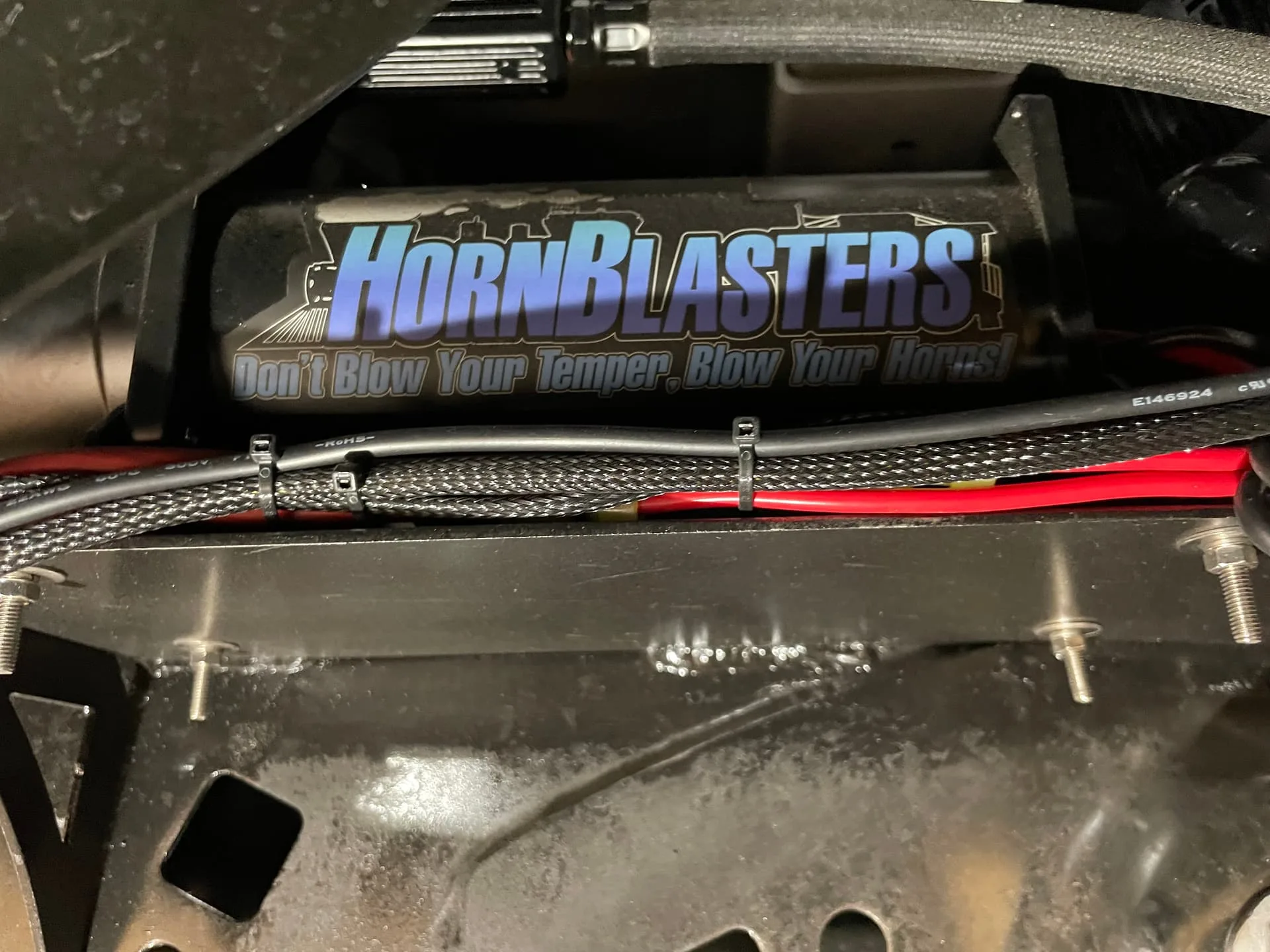 Close-up HornBlasters air compressor with logo and Don't Blow Your Temper slogan photo 9