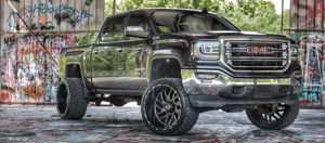 Exterior three-quarter view of Austin's 2016 GMC Sierra 1500 with HornBlasters Conductor's Special Spare Tire Delete kit featured customer install gallery photo 1