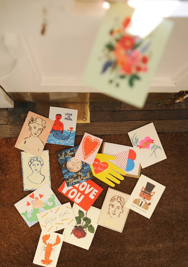 A scattering of Valentines cards on a door mat.
