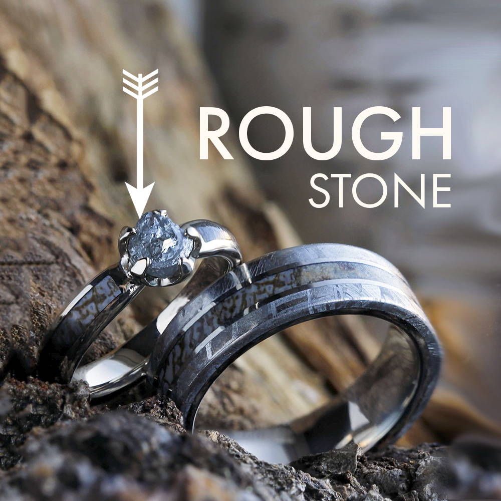 Rough stone engagement ring with dinosaur bone