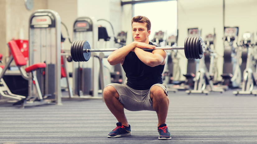 athlete squatting with bar on back