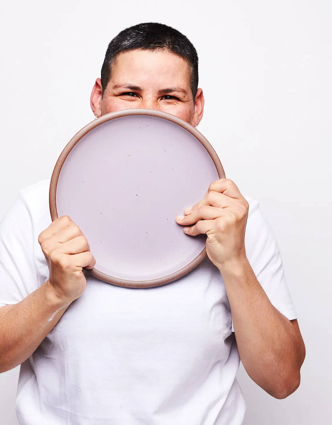 Karla holding an East Fork Dinner Plate in Taro