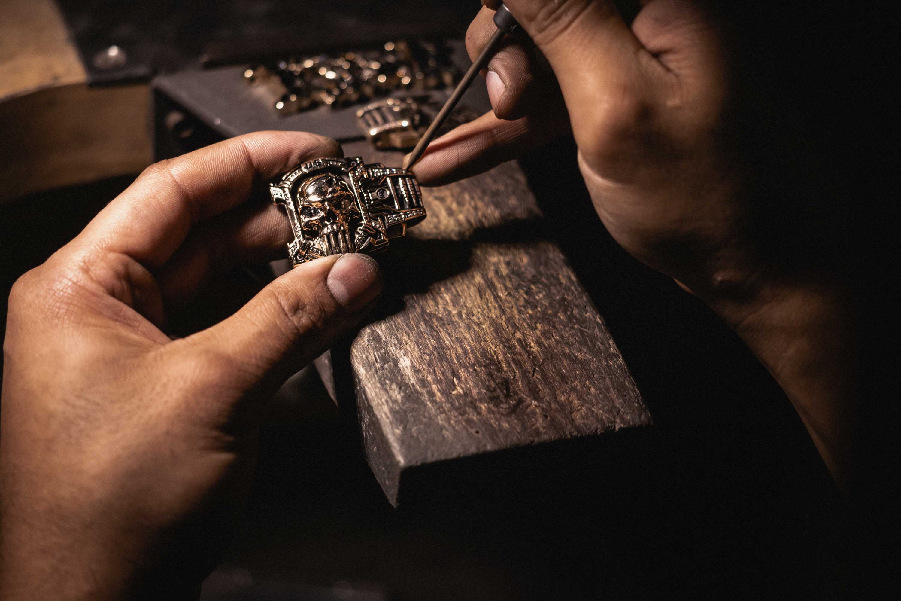 Setting diamonds in the 14K Jawbone Collection edition of the Sheepdog Interlock Bracelet