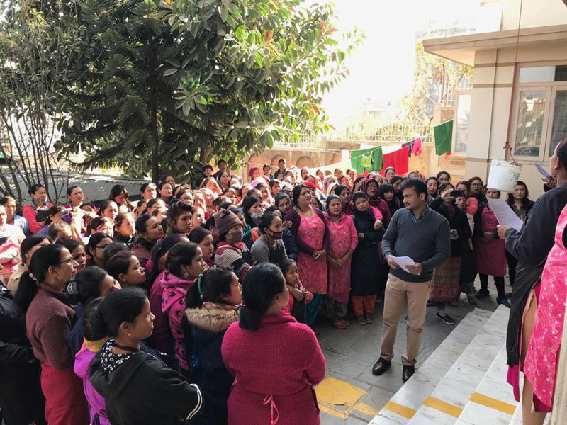 Fair Trade meeting with factory workers and owner.