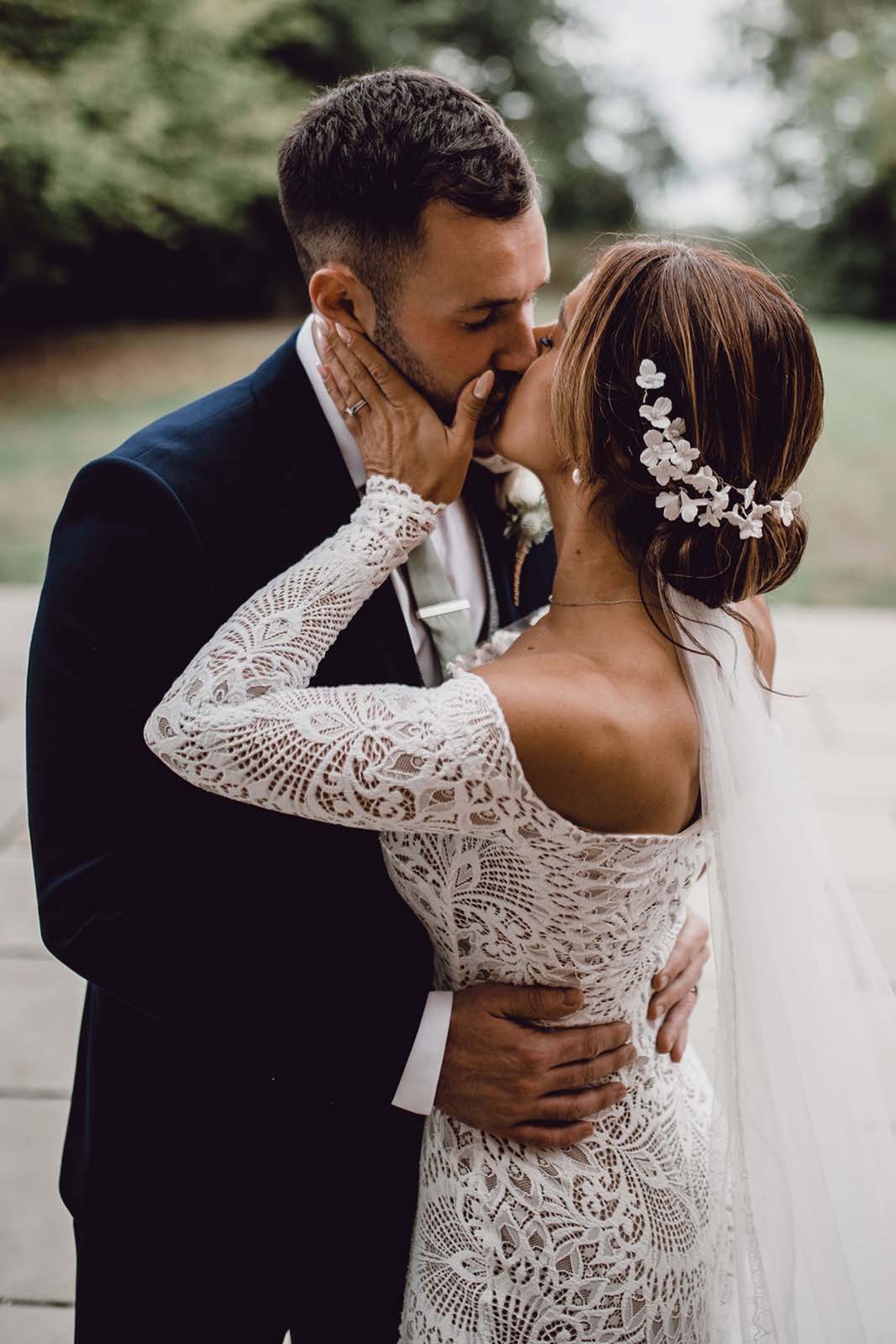 Bride, sharing a romantic kiss with the groom