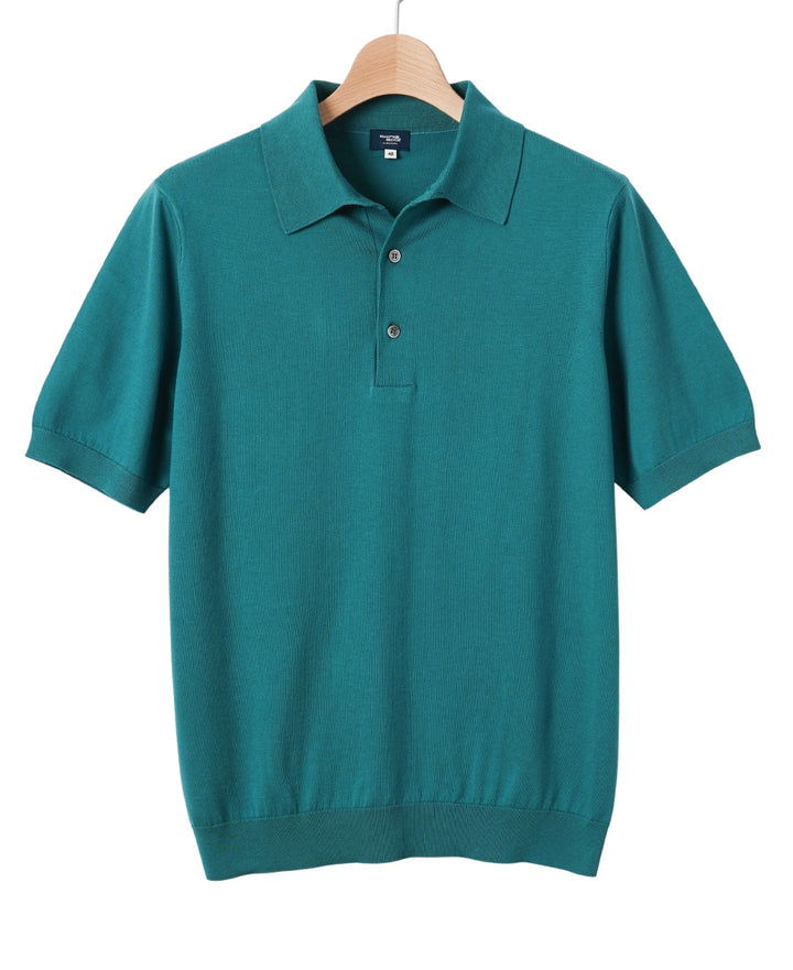 Teal short-sleeve polo shirt hanging on a wooden hanger.
