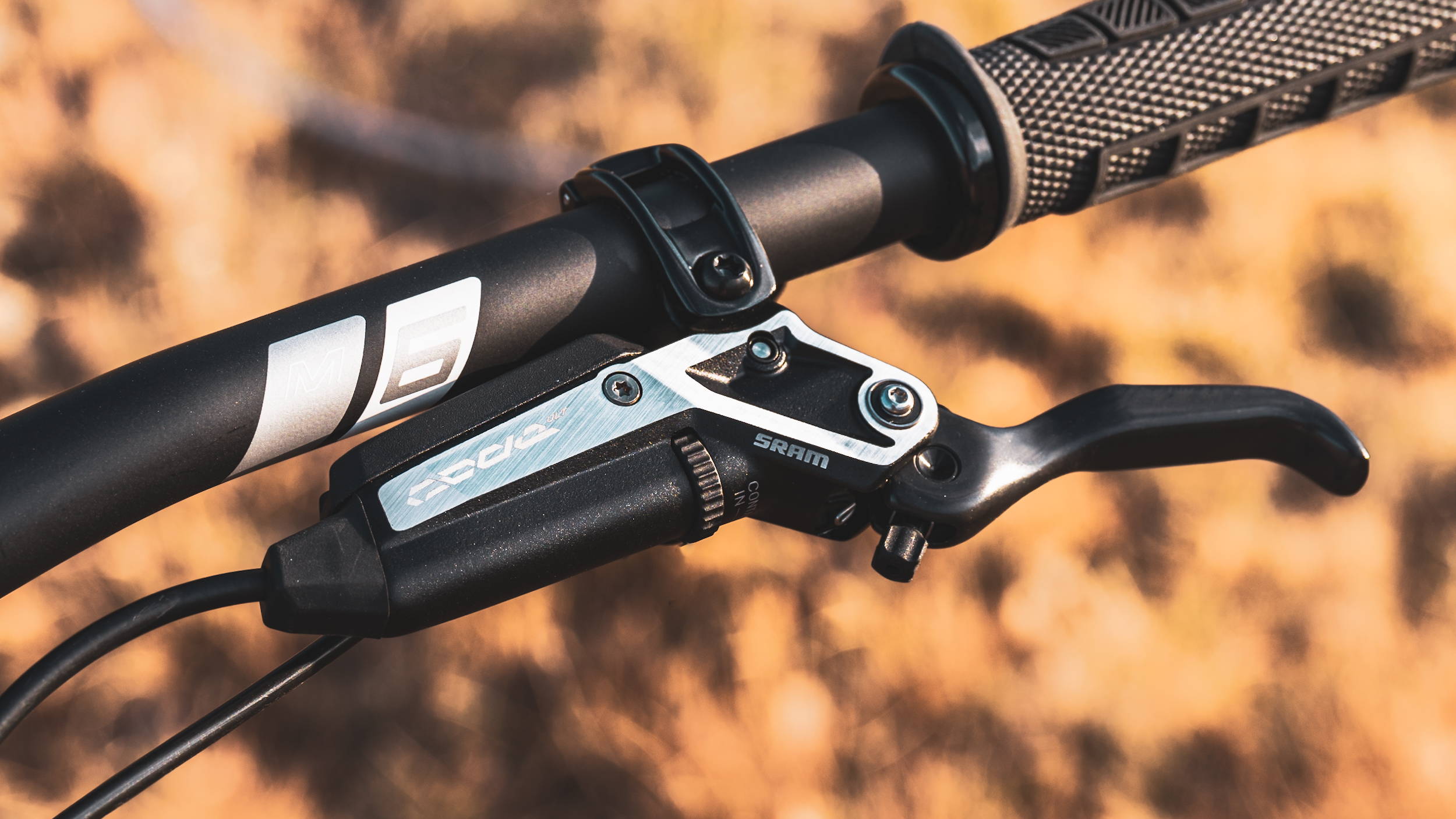 SRAM Code Stealth Ultimate Lever mounted on Enve handlebars with ODI Grips