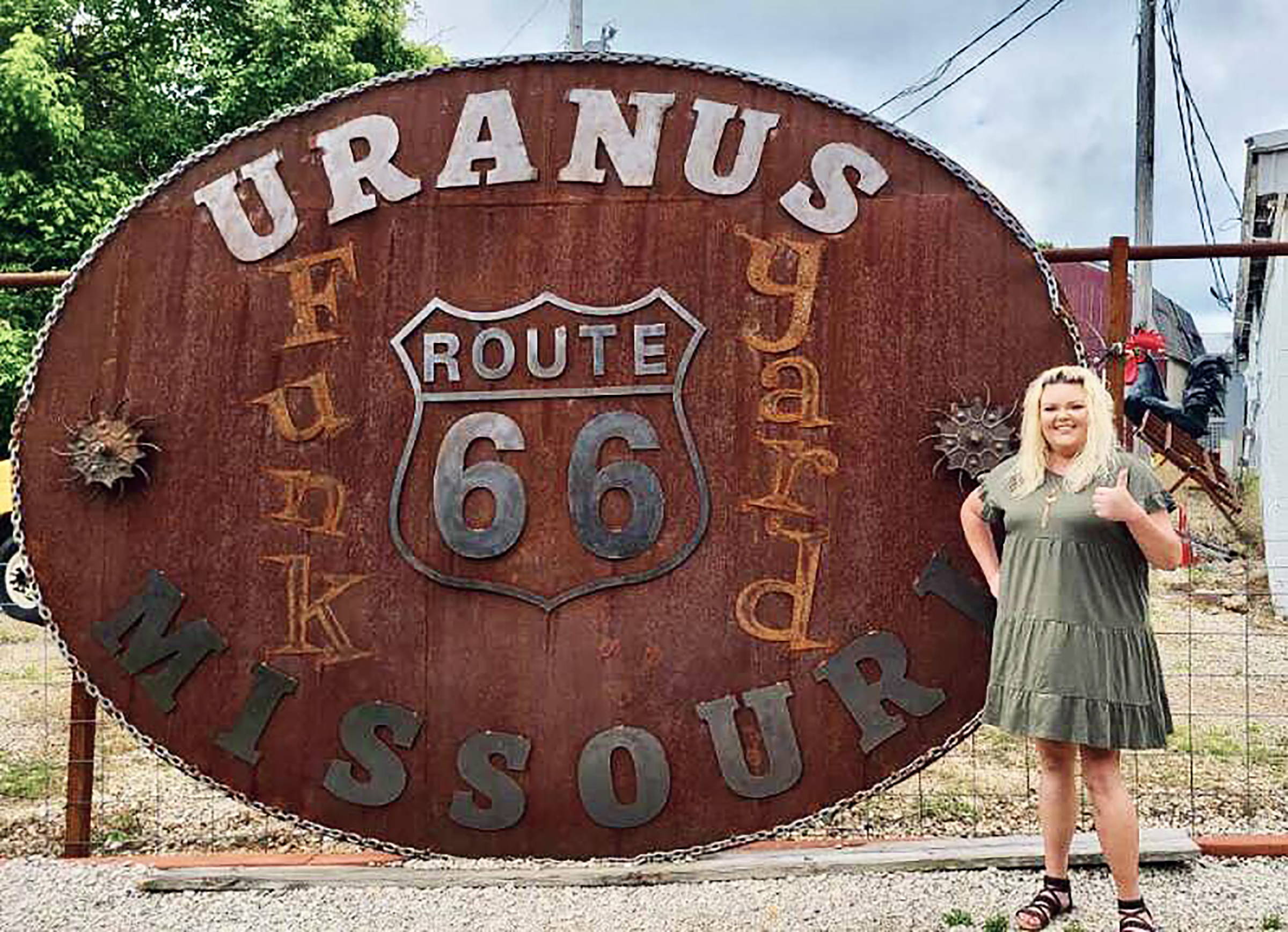 Miss Tiffany next to the World's Largest Belt Buckle in Uranus.