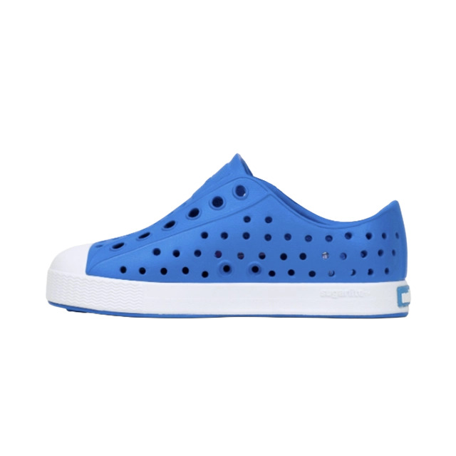 Blue perforated slip-on shoe with a white sole.