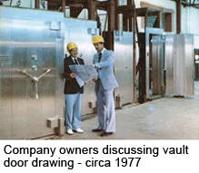 Company owners discussing vault door drawing circa 1977