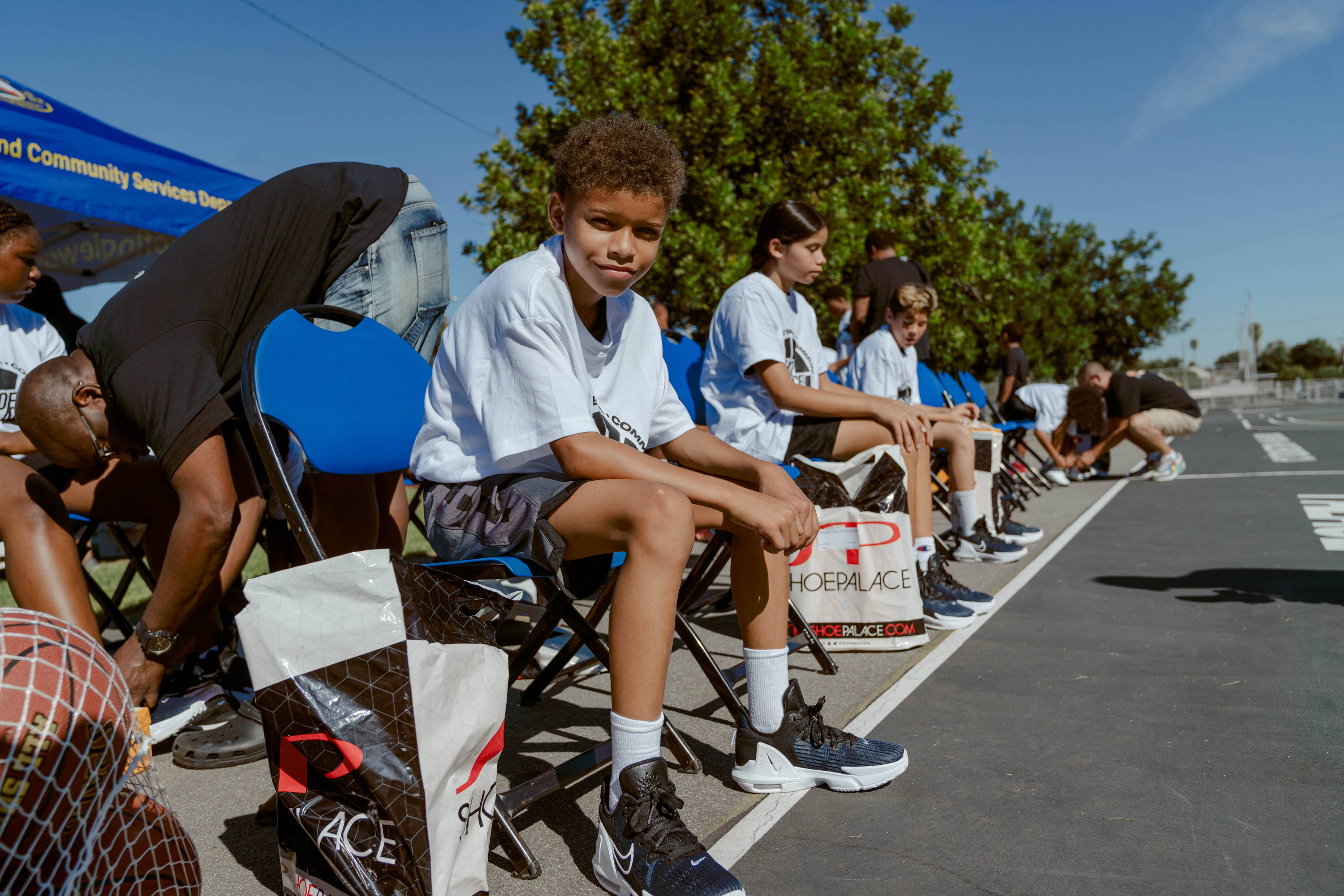 darby park hoop clinic boy smiles at camera