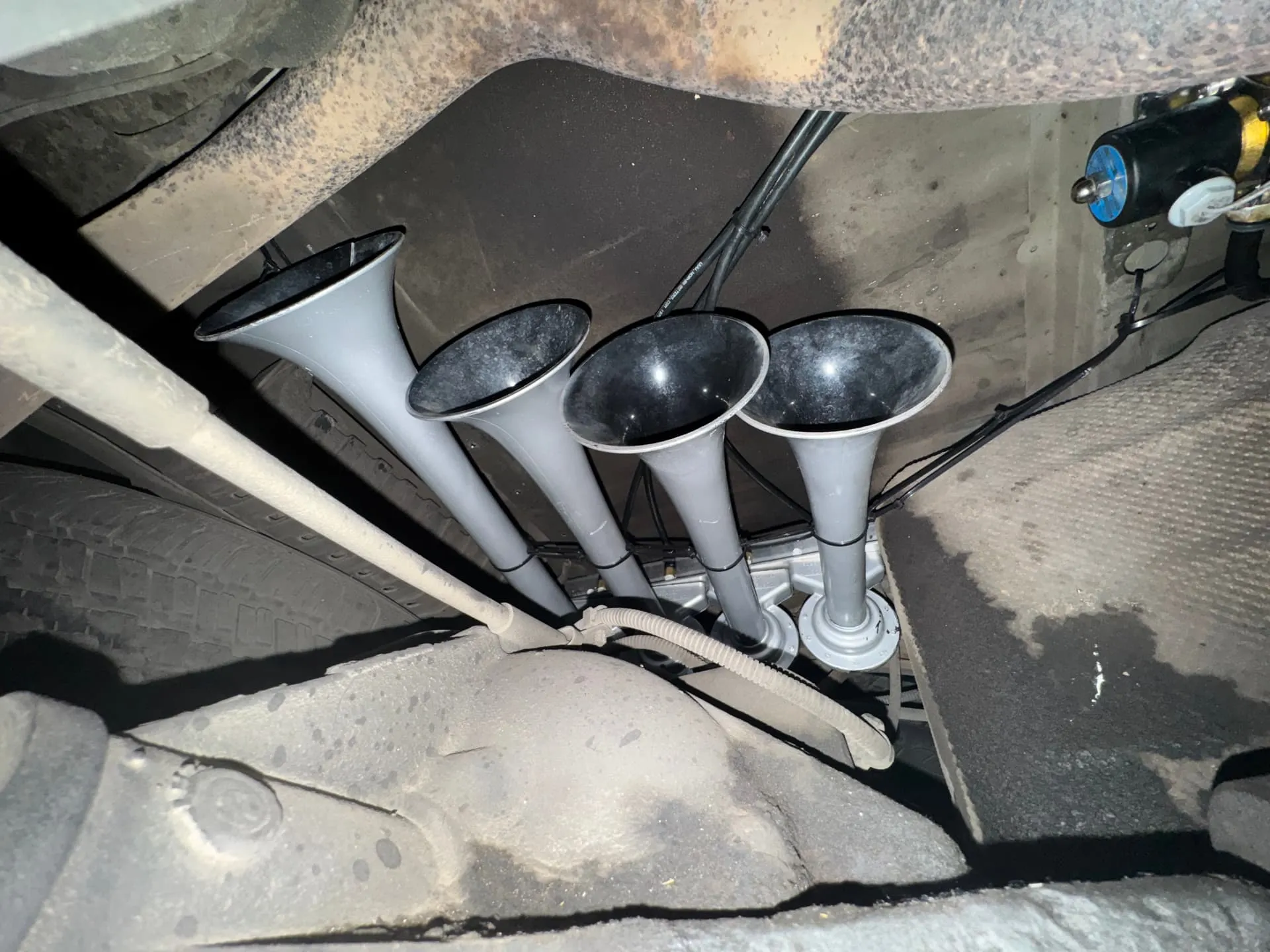 Four grey Shocker XL train horn trumpets mounted on Joshua's Ford Ranger undercarriage photo 3