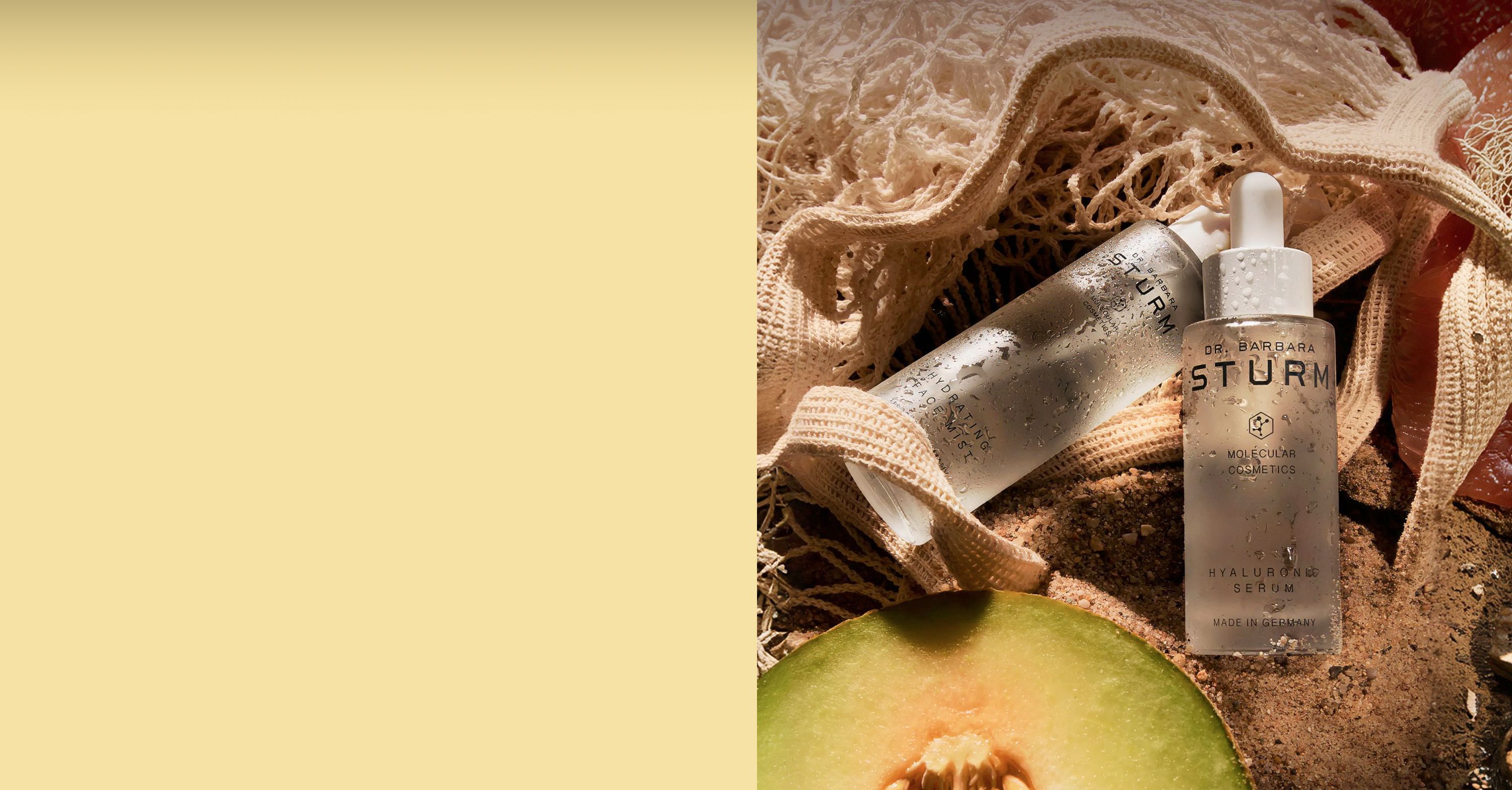 Bottles of skincare products near a cut melon on natural background.