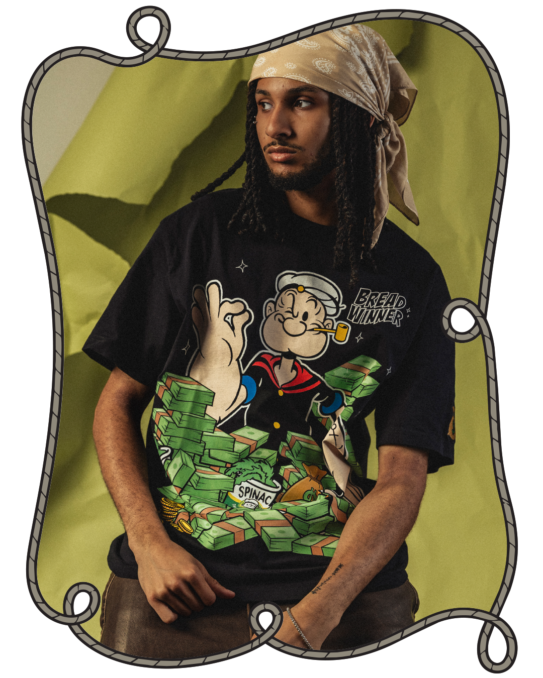 Person wearing a Popeye graphic t-shirt against a colorful background.