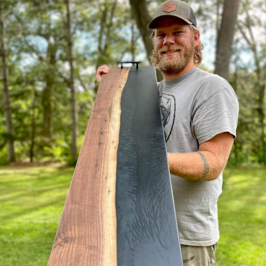 ryan from sawdustandstuff holding a long river table tray outside