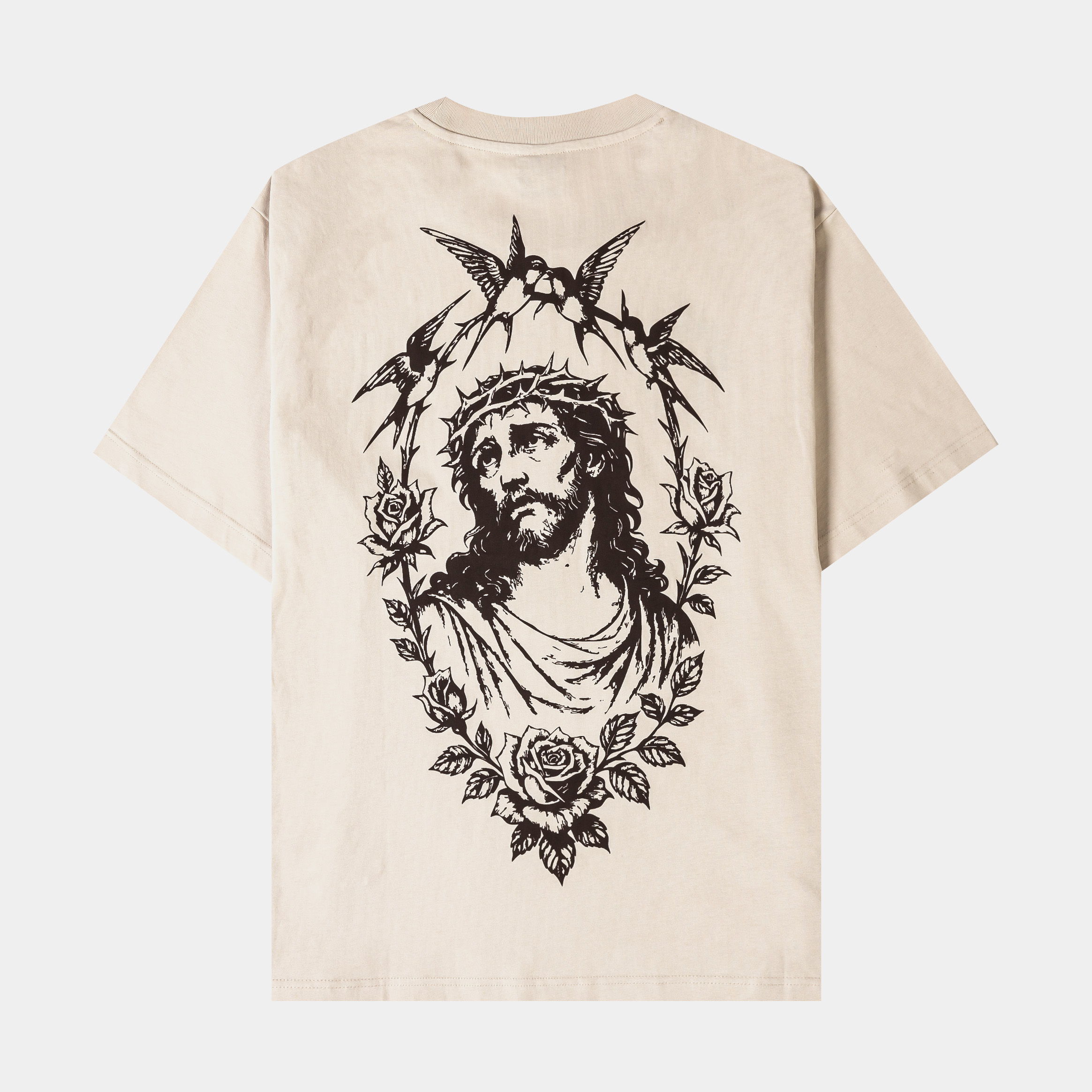 Beige t-shirt with graphic designs on the front.