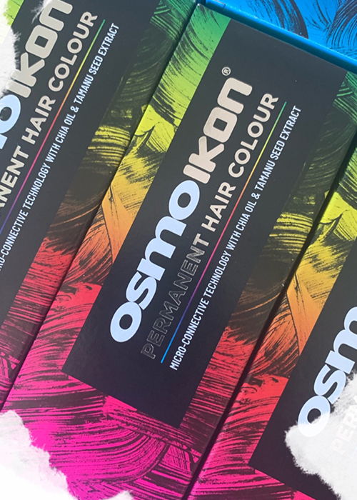 Boxes of Osmokoni permanent hair color in vibrant colors.