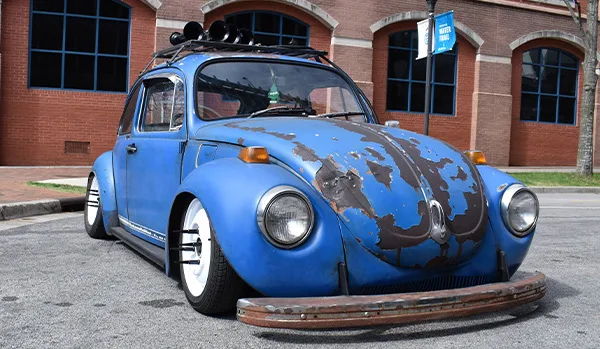 Front three-quarter blue patina 1971 Volkswagen Super Beetle with roof horns Zach's Shocker XL install gallery photo 5