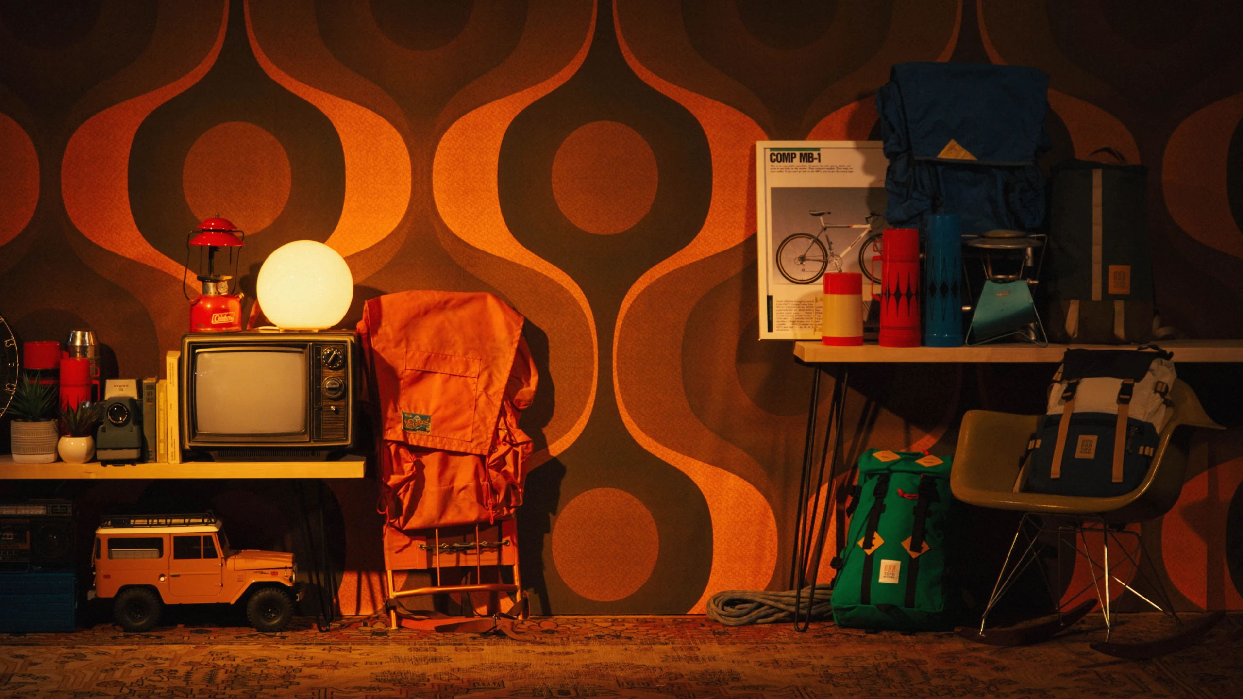 Retro room setup with vintage TV, lamp, and various colorful items.