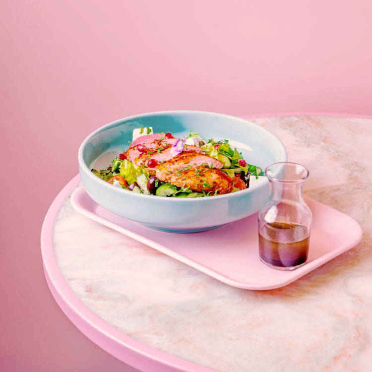Mediterranean Chicken Salad on pink tray