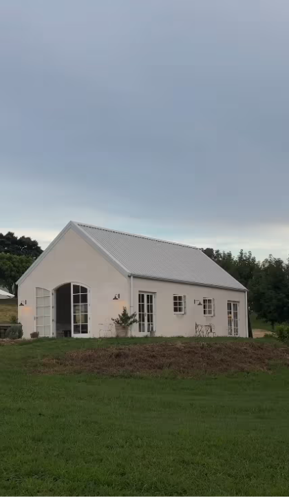 Farmhouse style house with outdoor wall lights