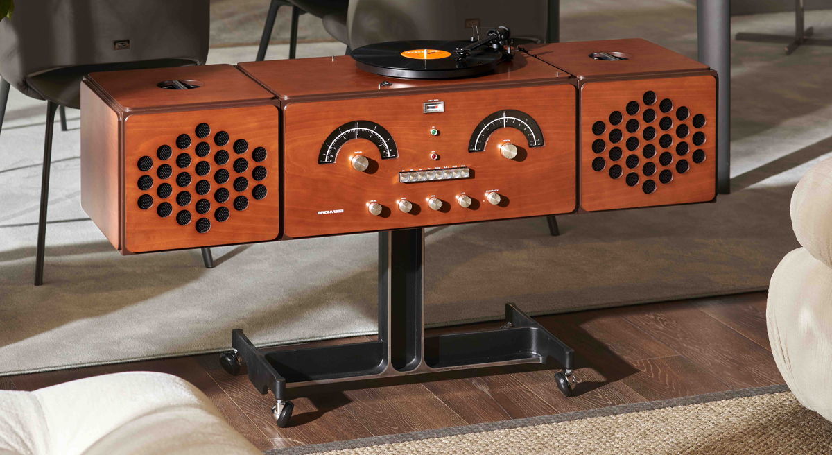 Wooden Brionvega stereo console with turntable and speaker grilles.