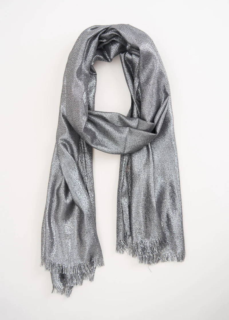 A silver metallic scarf with tassel ends