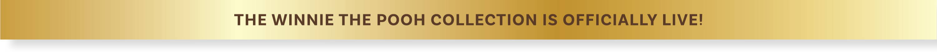 Text on a gold background with a white bottom border. Winnie The Poo Collab