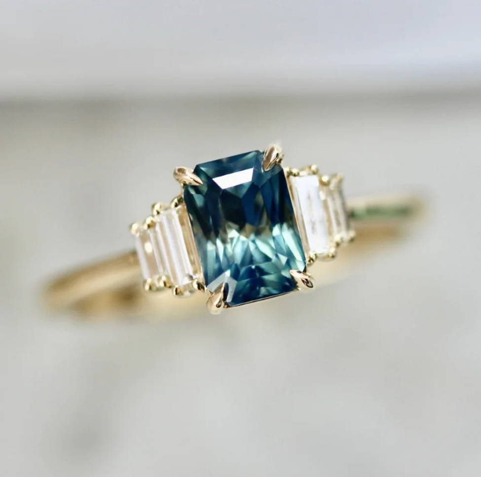 teal radiant cut sapphire ring