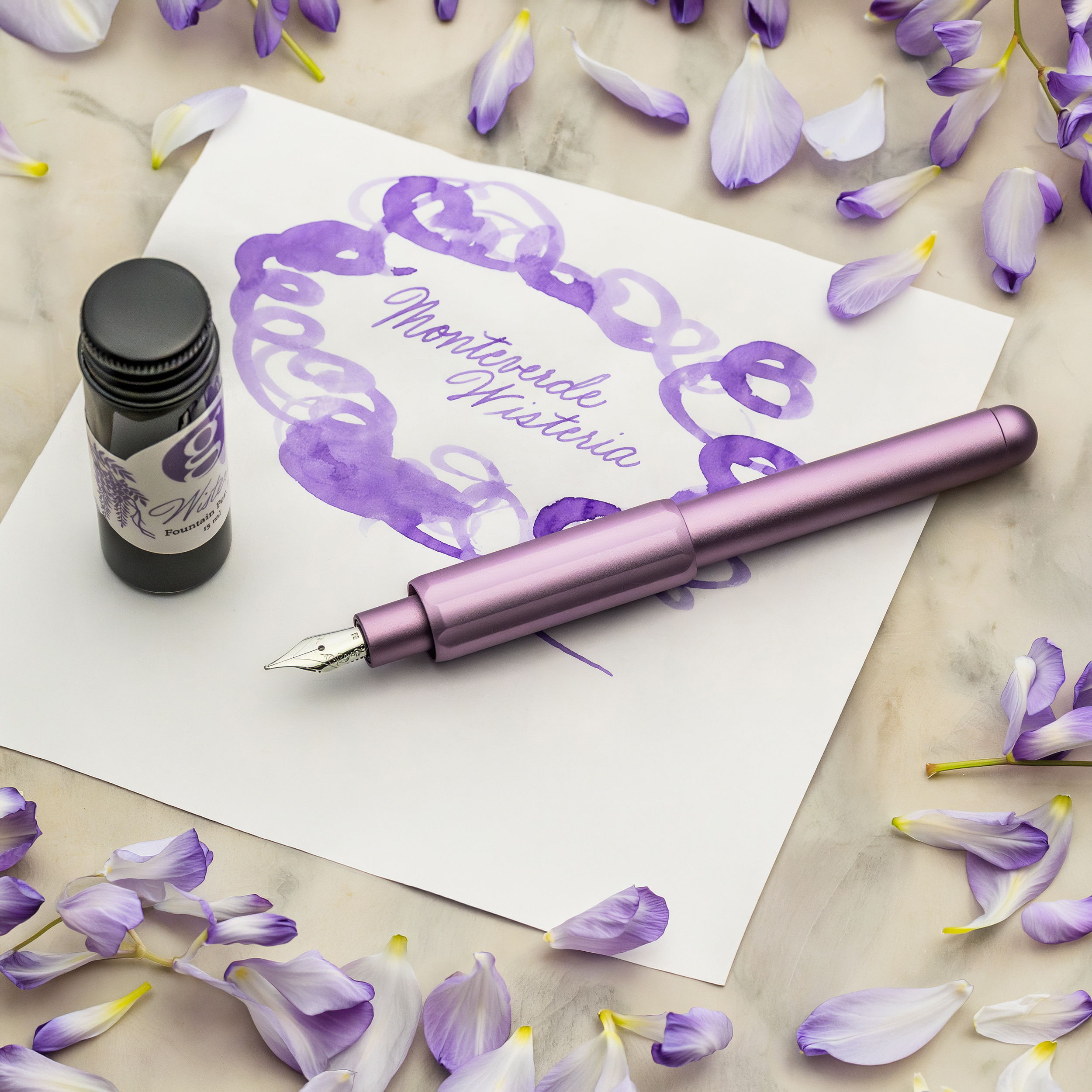 Monteverde Axis Wisteria Fountain Pen with wisteria petals and matching ink