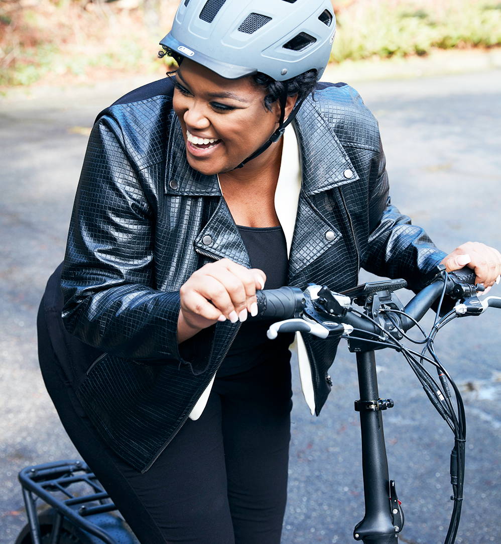 Woman laughing on a rad bike