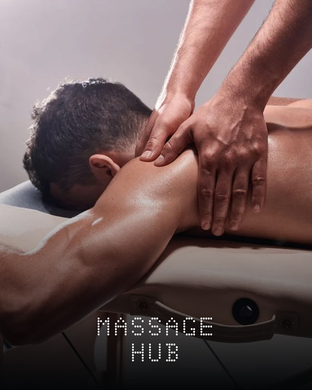 Person receiving a massage on a massage table. Text overlay: 