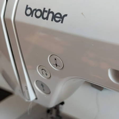 Needle down button on a Brother machine