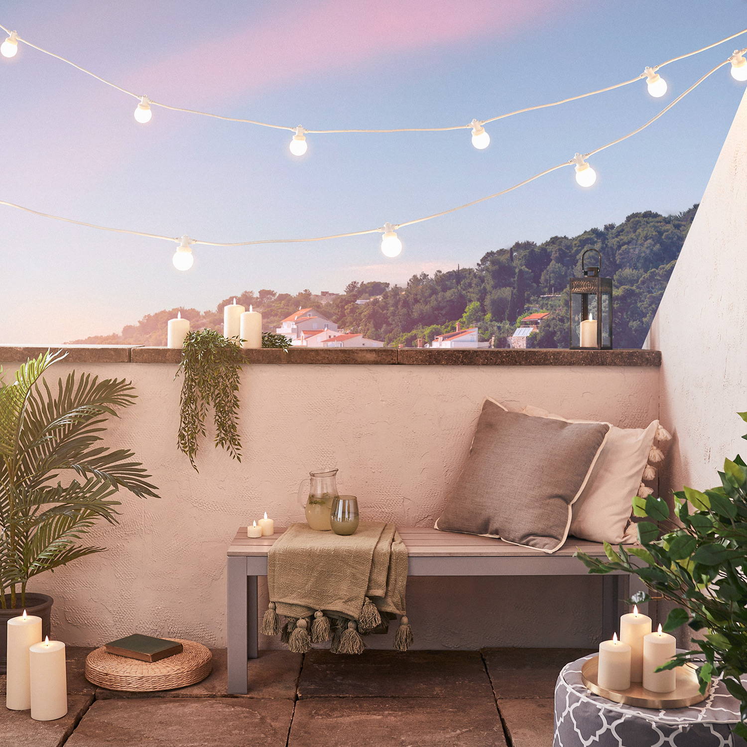White festoons on white cable illuminated across balcony