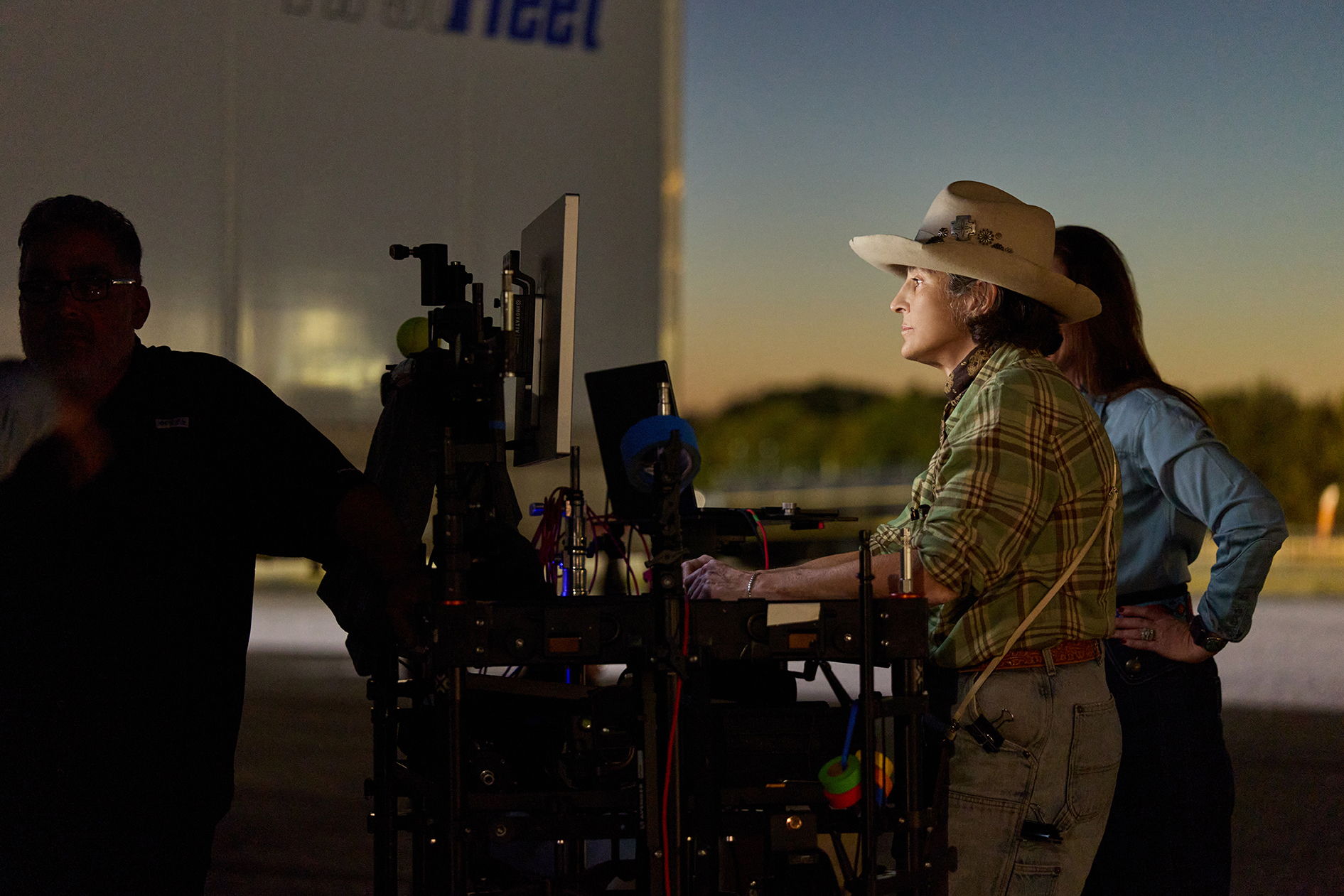Cheryl checking images behind the set as the crew captures each shot.
