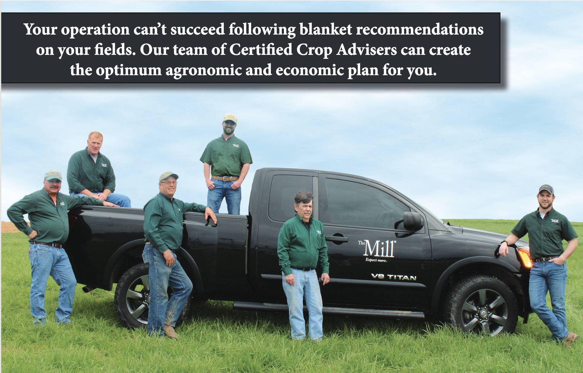 Five crop advisors posing around a black pickup truck in a grassy field with an agronomy planning message above.