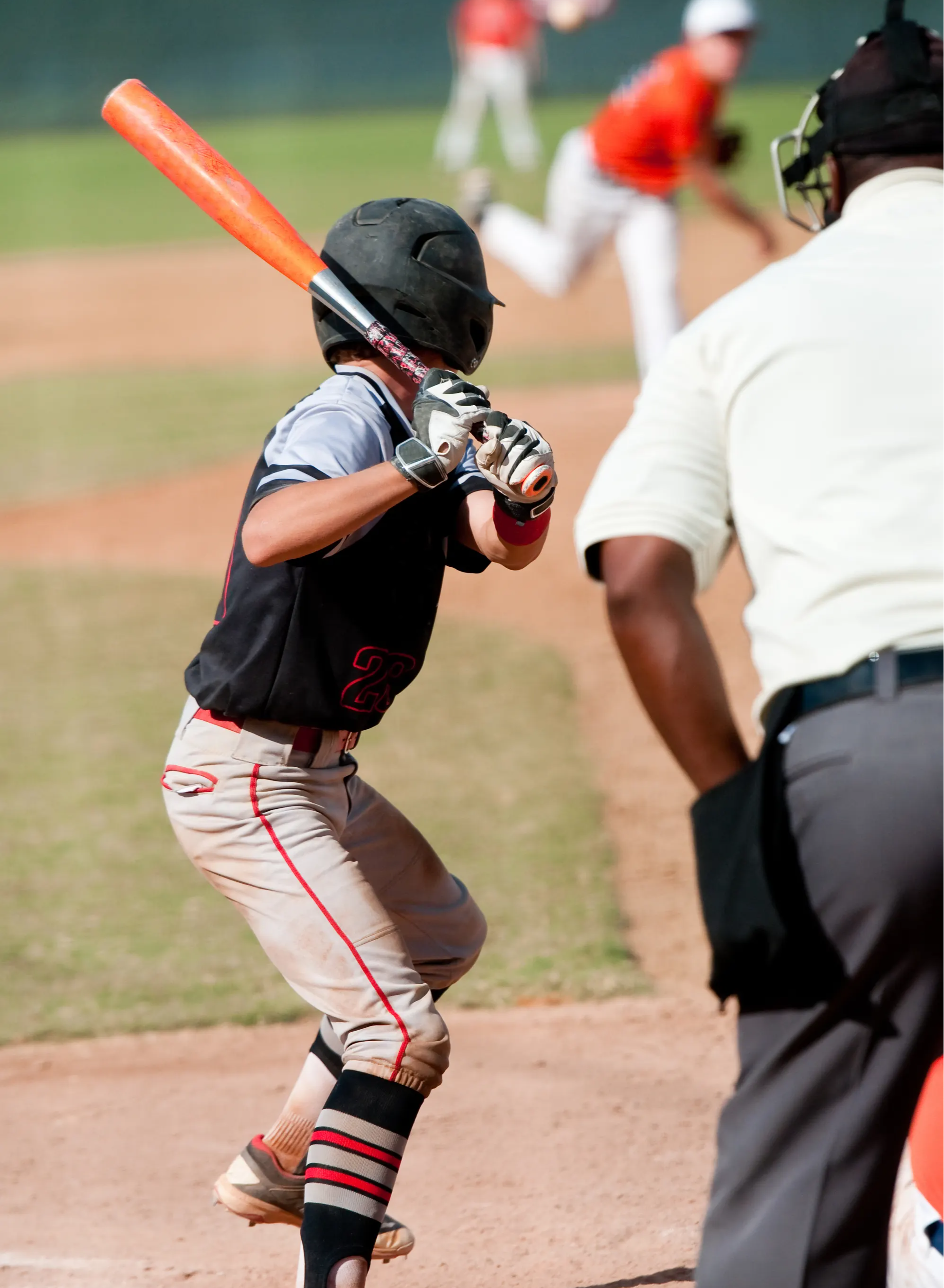 boy playing baseball, wearing compression