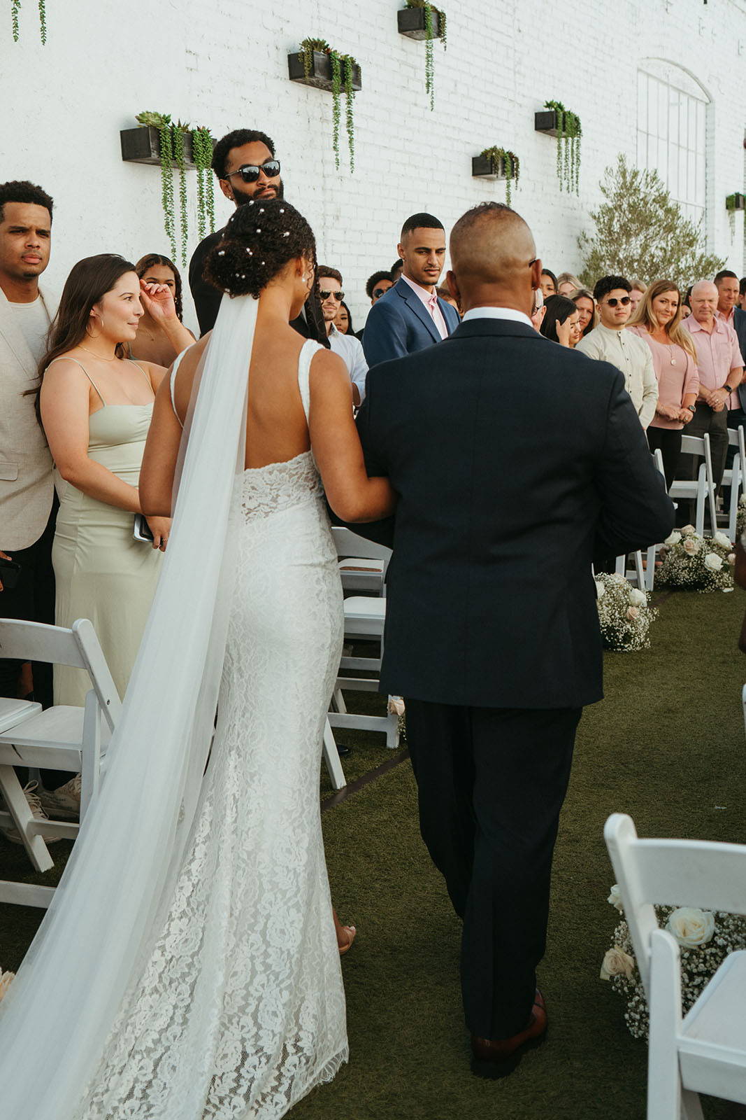 Bride and father walking down the aisle