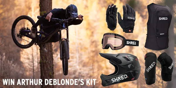 Arthur Deblonde in action, mountain biking, accompanied by images of the SHRED. MTB gear kit one can win, including Full Face Helmet, MTB Goggles, Knee Pads, Protective Gloves, and a Back Protector.