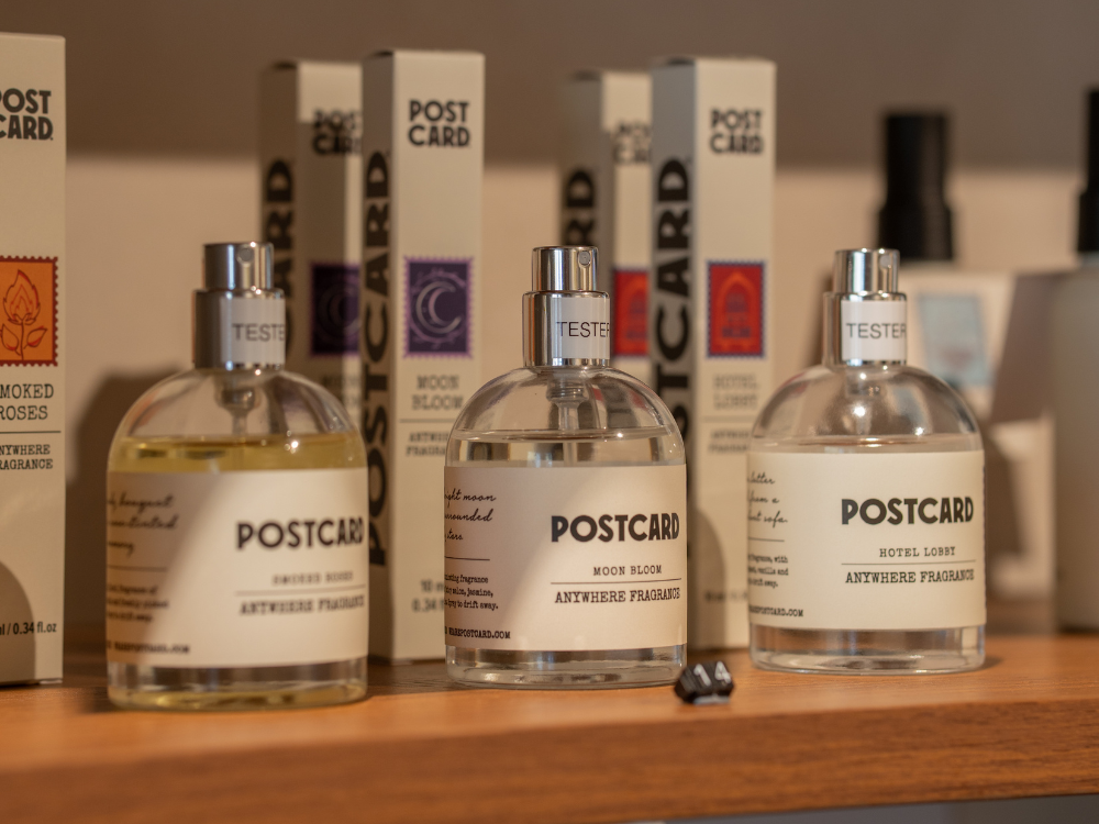3 perfume bottles displayed on a shelf