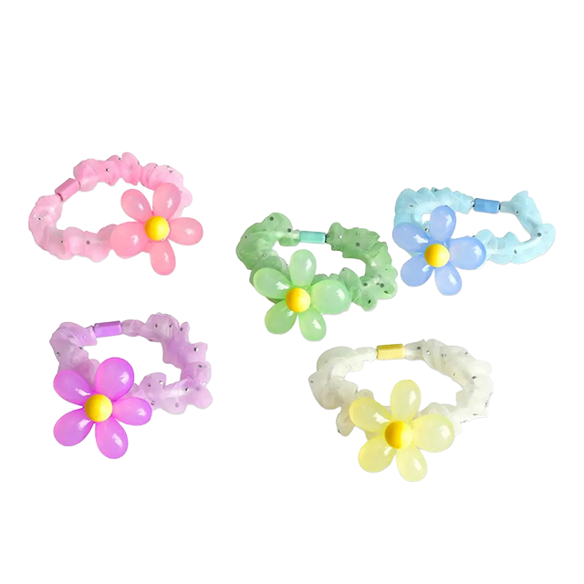 Colorful flower-shaped hair accessories in various pastel shades.