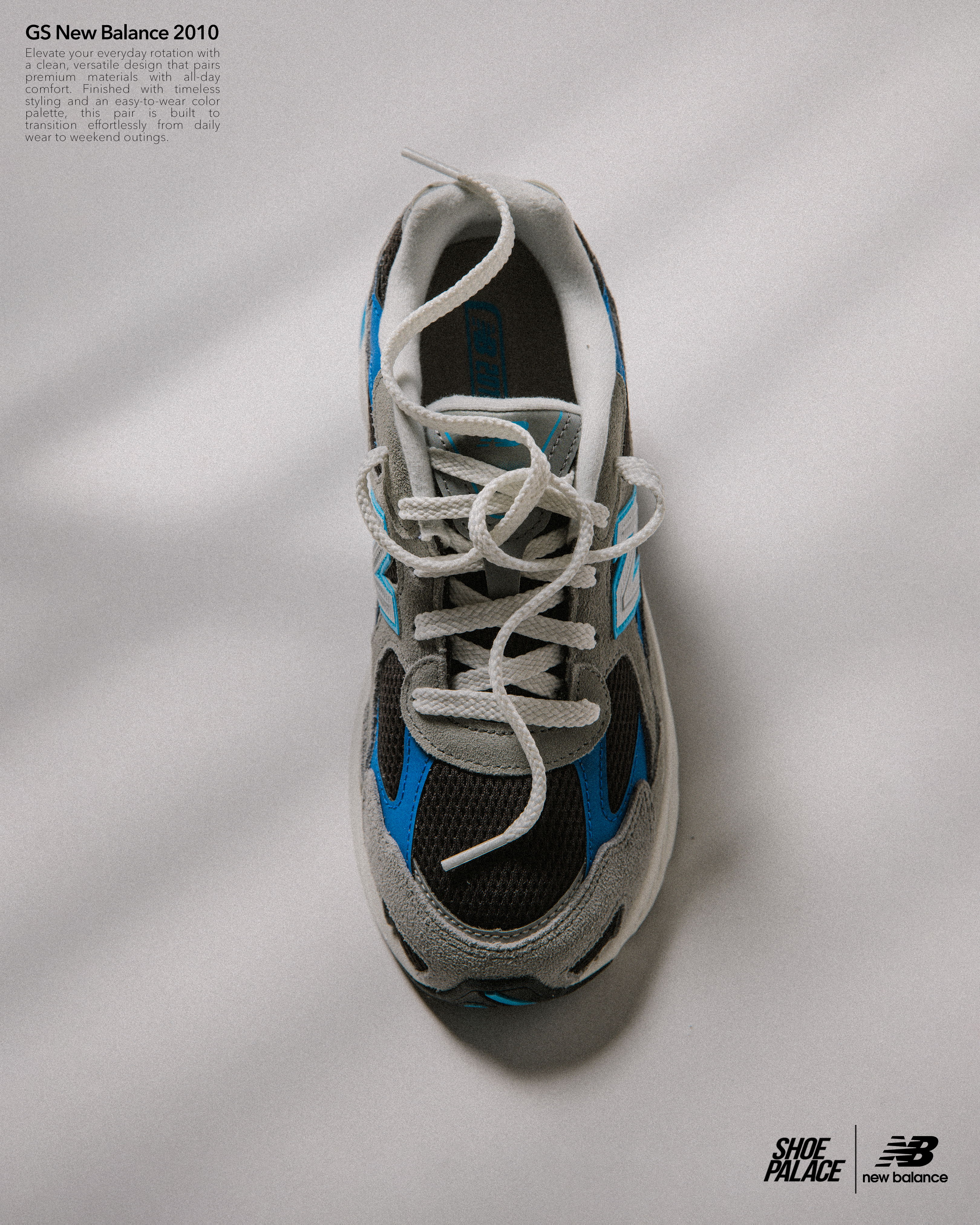 A top view of a New Balance sneaker in gray and blue.