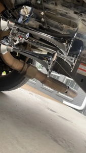 Dual chrome train horns mounted to the underside of Troy's Ford F250